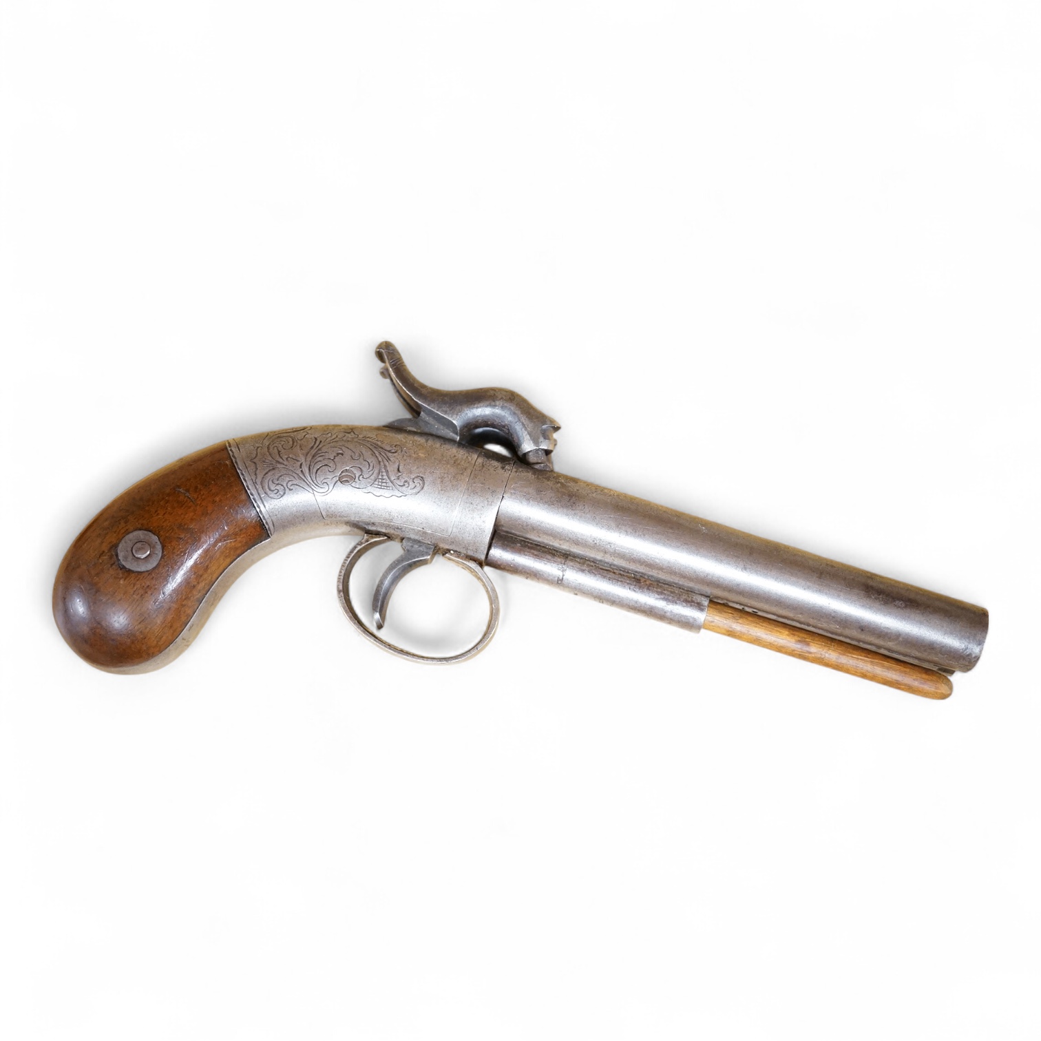 A double barrel American boxlock percussion pocket pistol with rounded frame roll engraved with foliage, and two-piece, bag shaped walnut grips